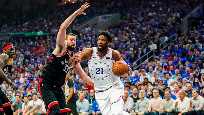 Joel Embiid drives against the Raptors